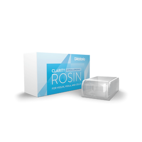 The image shows a D'Addario Clarity Rosin designed for violin, viola, and cello. It includes a blue and white retail box labeled "Hypoallergenic" and "Clarity Rosin," and a clear plastic case holding the rosin cake. This premium rosin produces less dust and is gentler for sensitive players. D'Addario is a trusted maker of professional-quality string instrument accessories.