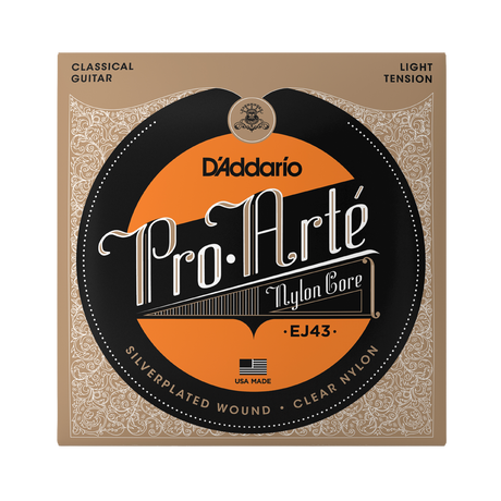 D'Addario Pro Arte EJ43 nylon core classical guitar strings in its original packaging, featuring a tan and black ornate design with a prominent orange circular label.