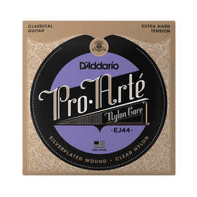 D'Addario Pro.Arté EJ44 classical guitar nylon core strings in its original packaging, featuring a tan and black ornate border with a central purple and black circular label.