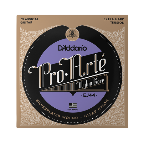 D'Addario Pro.Arté EJ44 classical guitar nylon core strings in its original packaging, featuring a tan and black ornate border with a central purple and black circular label.