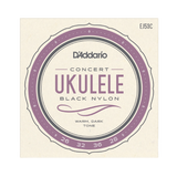 D'Addario Concert Ukulele Black Nylon guitar strings packaging, featuring a circular label with purple and gray accents on a cream background.