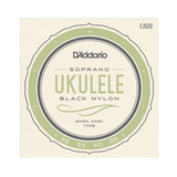 D'Addario Soprano Ukulele Black Nylon strings package, featuring a circular label with sage green and dark gray details on a cream-colored background.