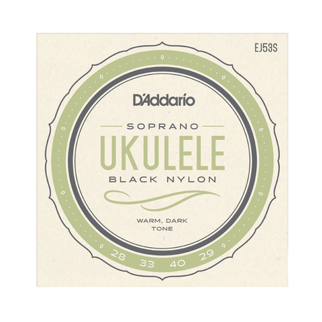D'Addario Soprano Ukulele Black Nylon strings package, featuring a circular label with sage green and dark gray details on a cream-colored background.
