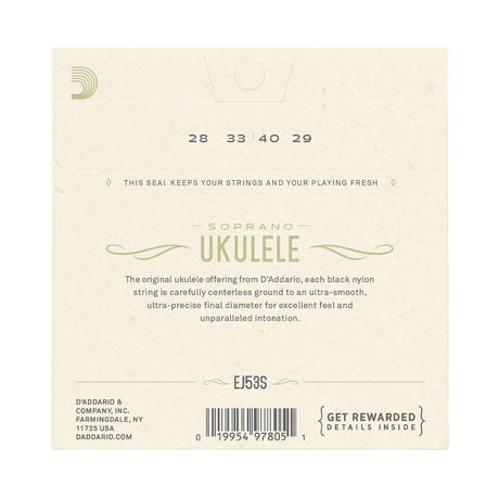 Back of a D'Addario EJ5S Soprano Ukulele package, showing product information, string numbers 28 33 40 29, a barcode, and a black string seal on a light beige background.