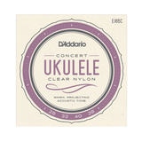 D'Addario Concert Ukulele Clear Nylon guitar strings package, model EJ65C, featuring a cream-colored square card with a purple and gray circular label design.