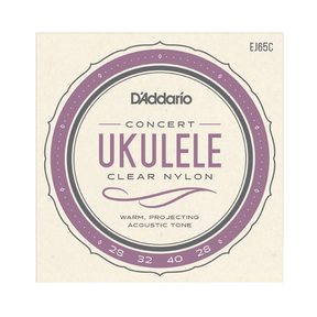 D'Addario Concert Ukulele Clear Nylon guitar strings package, model EJ65C, featuring a cream-colored square card with a purple and gray circular label design.