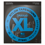 D'Addario ETB92 Nylon Tapewound Medium Gauge guitar strings in black, shown in its retail packaging. The box features a black background with a large blue circular graphic containing the text 'NYLON TAPEWOUND', 'XL', and 'MEDIUM GAUGE'.