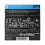 Back of a D'Addario guitar string package, showing product information, a bridge illustration, a string tension gauge graphic, and a barcode on a dark gray background with a blue header.