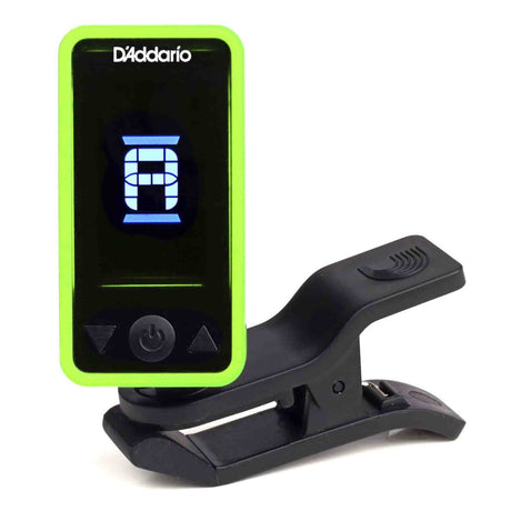 The image shows a D'Addario clip-on electronic tuner with a bright green casing and black LCD screen displaying a tuning interface. It features a sturdy black clip to attach to instruments, control buttons on the front, and a compact design. This popular tuner detects vibrations for accurate tuning in noisy settings, commonly used with guitars, basses, violins, and other stringed instruments.
