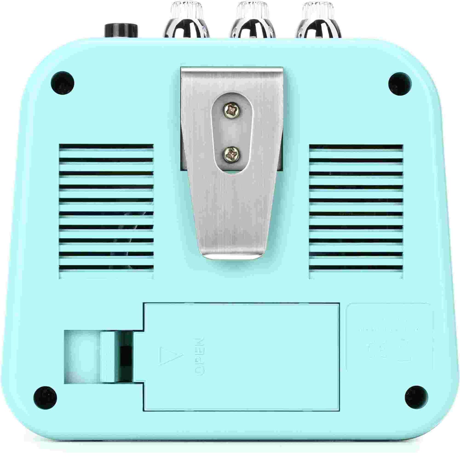Turquoise guitar effects pedal with metallic clip on a white background