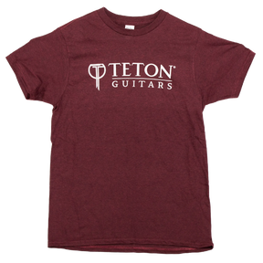 The image shows a maroon t-shirt featuring the Teton Guitars logo, displayed on a white background.