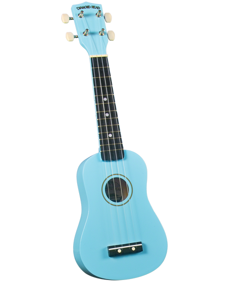 The image shows a light blue/turquoise Diamond Head ukulele with a dark fretboard featuring white fret markers. It has four strings, four tuning pegs with cream buttons, a central sound hole with decorative rings, and a black bridge. The instrument has a classic soprano or concert size shape, offering a vibrant and appealing look typical of beginner to intermediate ukuleles.