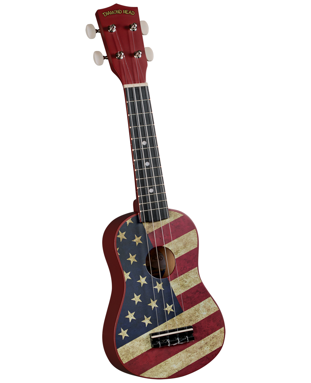The image shows a soprano ukulele with a vintage-style American flag design on the body. It has a red headstock with gold "DIAMOND HEAD" branding, four white tuning pegs, a dark fretboard with white fret markers, and four strings. The sound hole is centered. This patriotic-themed ukulele blends traditional Hawaiian style with Americana imagery, representing a Diamond Head brand instrument.