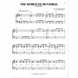 The image shows a page of sheet music for "The World Es Mi Familia" from Disney-Pixar's "Coco." It features piano notation in C major, 6/8 time, marked "Moderately fast, in 2," with chord symbols (C, G, F, G7) and Spanish lyrics labeled for the character Miguel. Credits include music by Germaine Franco and lyrics by Adrian Molina. The page is from a professionally published songbook with Disney copyright.