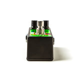 The bottom of a Jimi Hendrix guitar pedal with the footswitch visible along with the black finished bottom.