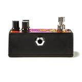The left side of a Jimi Hendrix guitar pedal with the black finish and output jack visible.