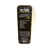 The bottom view of the yellow Kirk Hammett Dunlop wah pedal. The bottom is black with white text and lettering with descriptions.