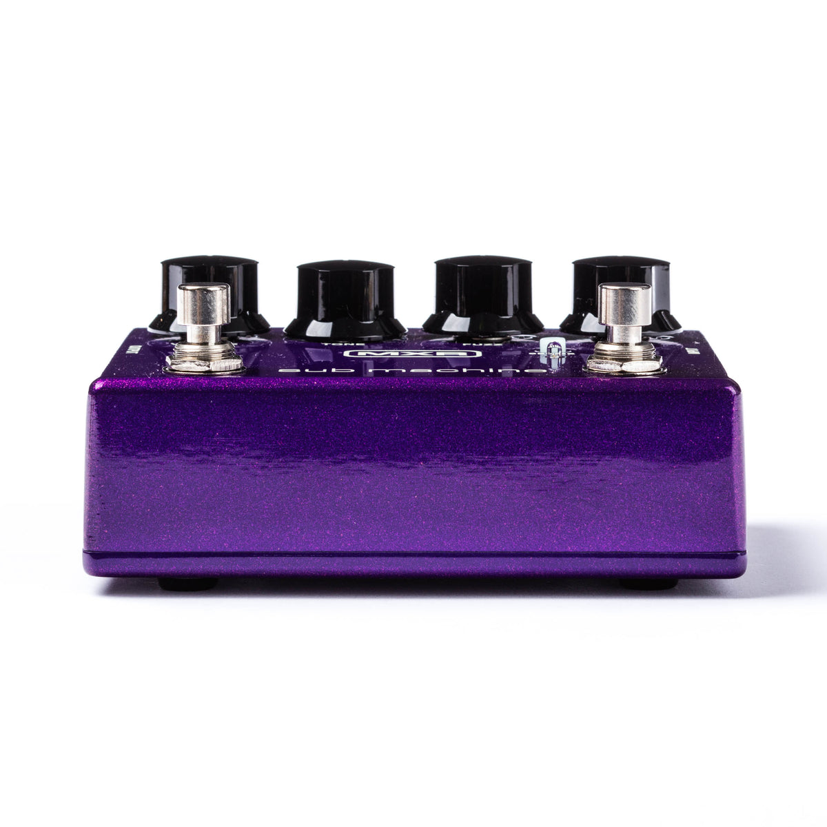 The bottom side of a MXR bass pedal with metallic purple finish.