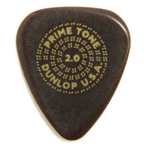 The image shows a Dunlop Primetone 2.0 guitar pick, made from a dark, tone-enhancing material. The "2.0" denotes its thickness in millimeters, offering control and a warm, full tone. The dotted circular pattern around the text provides grip. This premium pick is favored by serious guitarists for its durability and improved playing feel compared to standard picks.