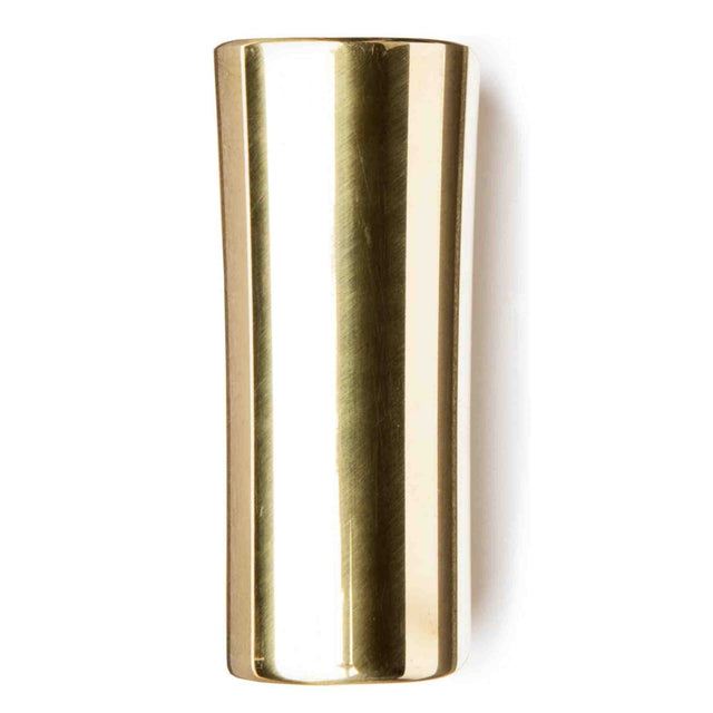 The image shows a brass guitar slide, a polished cylindrical tube used to create smooth, gliding tones by sliding along guitar strings. Commonly worn on the ring finger or pinky, slides come in various materials like glass, ceramic, steel, and brass, each affecting tone. Brass slides produce a warm, mellow sound with good sustain and are essential for blues, country, rock, and other slide guitar styles.