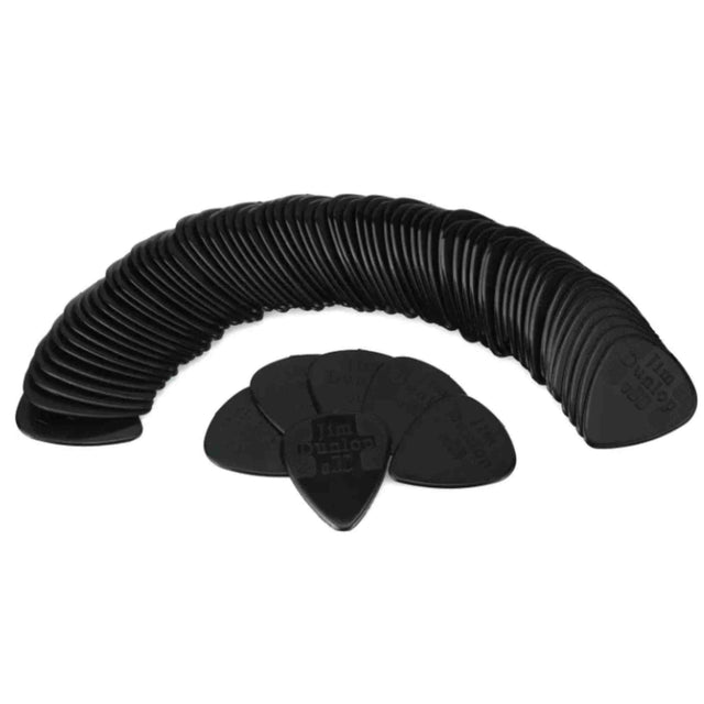 The image shows a collection of black guitar picks arranged in a curved, fan-like pattern. These standard teardrop-shaped plectrums are made of dark plastic, possibly celluloid, with faint embossed logos or text. Likely a bulk pack, they are essential accessories for guitar players used to strum or pluck strings and come in various materials and thicknesses to suit different playing styles.