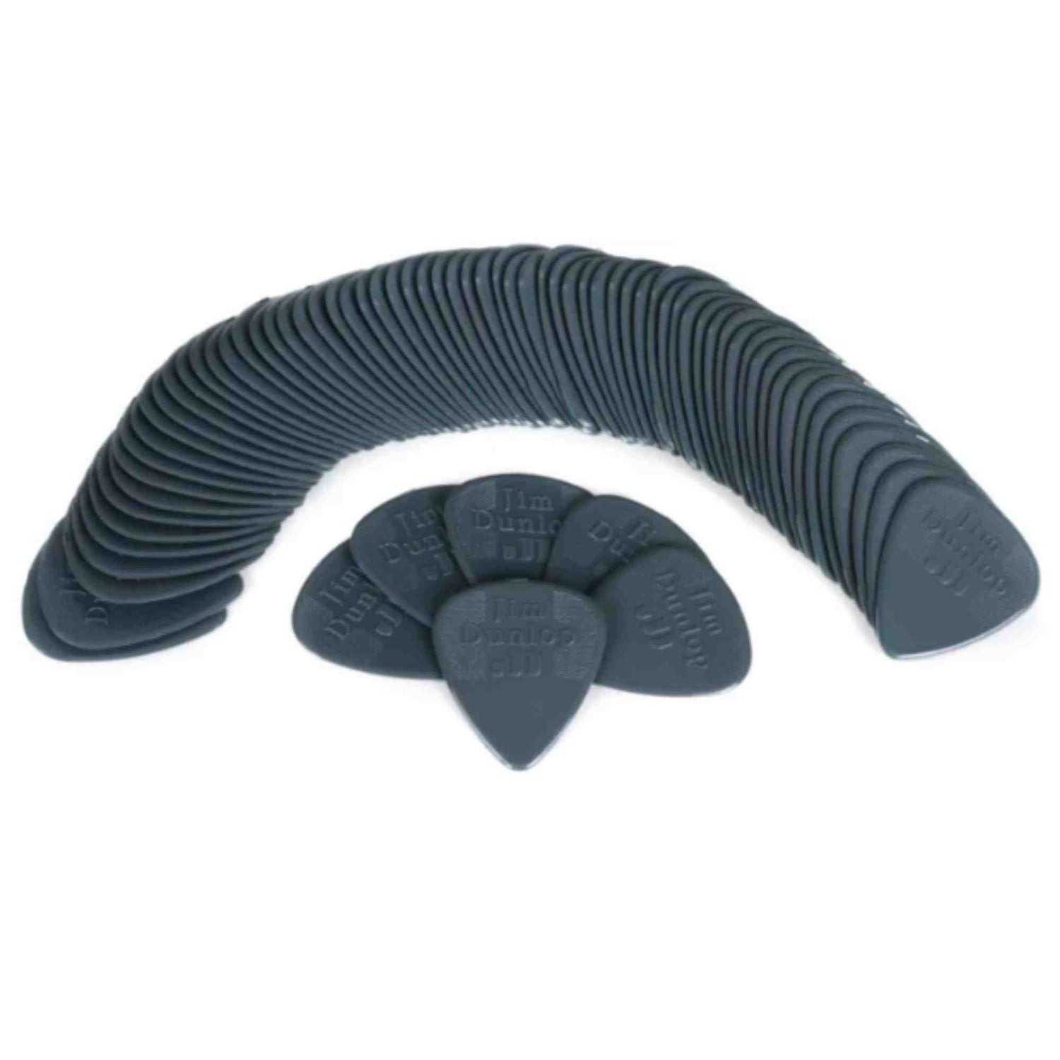 The image shows a collection of dark-colored, teardrop-shaped guitar picks arranged in a curved, fan-like pattern. Made of plastic or nylon, the picks have embossed or printed text, though details are unclear. The uniform color and branding suggest they are from the same manufacturer, likely a bulk pack or promotional display of identical picks commonly used for strumming or plucking guitar strings.