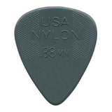 The image shows a dark gray nylon guitar pick with a classic teardrop shape. It features "USA NYLON" and "88MM" embossed on it, indicating a thickness of 0.88mm. The pick has textured crosshatch grip areas on both upper sides and a smooth playing tip. This medium-thickness pick offers durability, balanced tone, and improved grip for better control while playing.