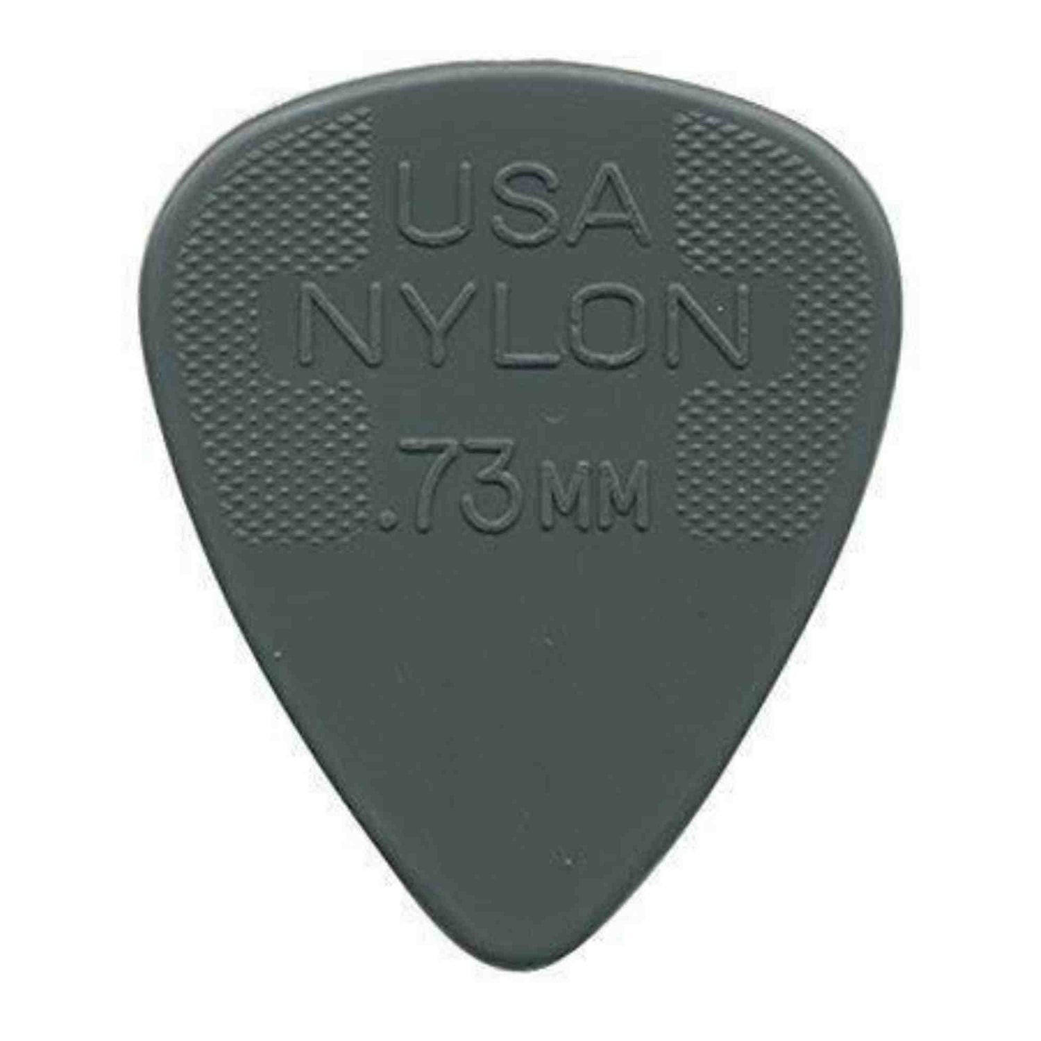 The image shows a gray nylon guitar pick with "USA NYLON .73MM" embossed on it, indicating its origin, material, and thickness. It has a classic teardrop shape with textured crosshatch grips on both sides near the wide end to prevent slipping. At .73mm thickness, it offers a balanced feel suitable for strumming and precise picking. This common pick is used by guitarists of all levels across genres.