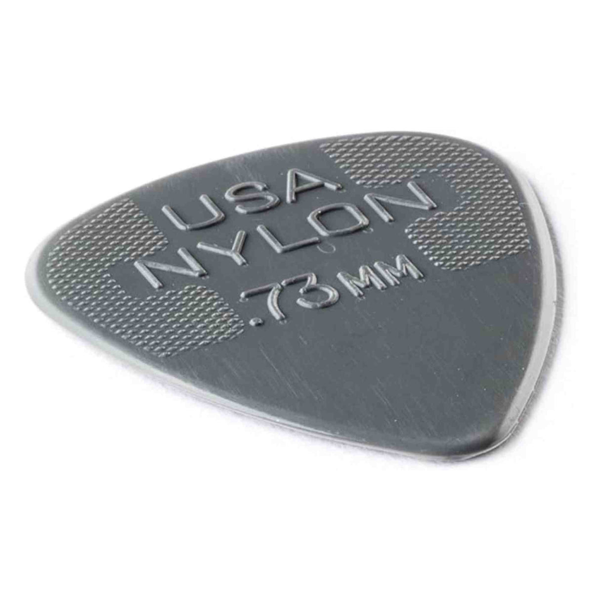 The image shows a Dunlop Nylon guitar pick in dark gray/black with a thickness of 0.73mm. It features the classic teardrop shape and textured crosshatched grip areas on the upper part to prevent slipping. This medium gauge pick is popular for its durability and balanced flexibility, suitable for both strumming and detailed picking.