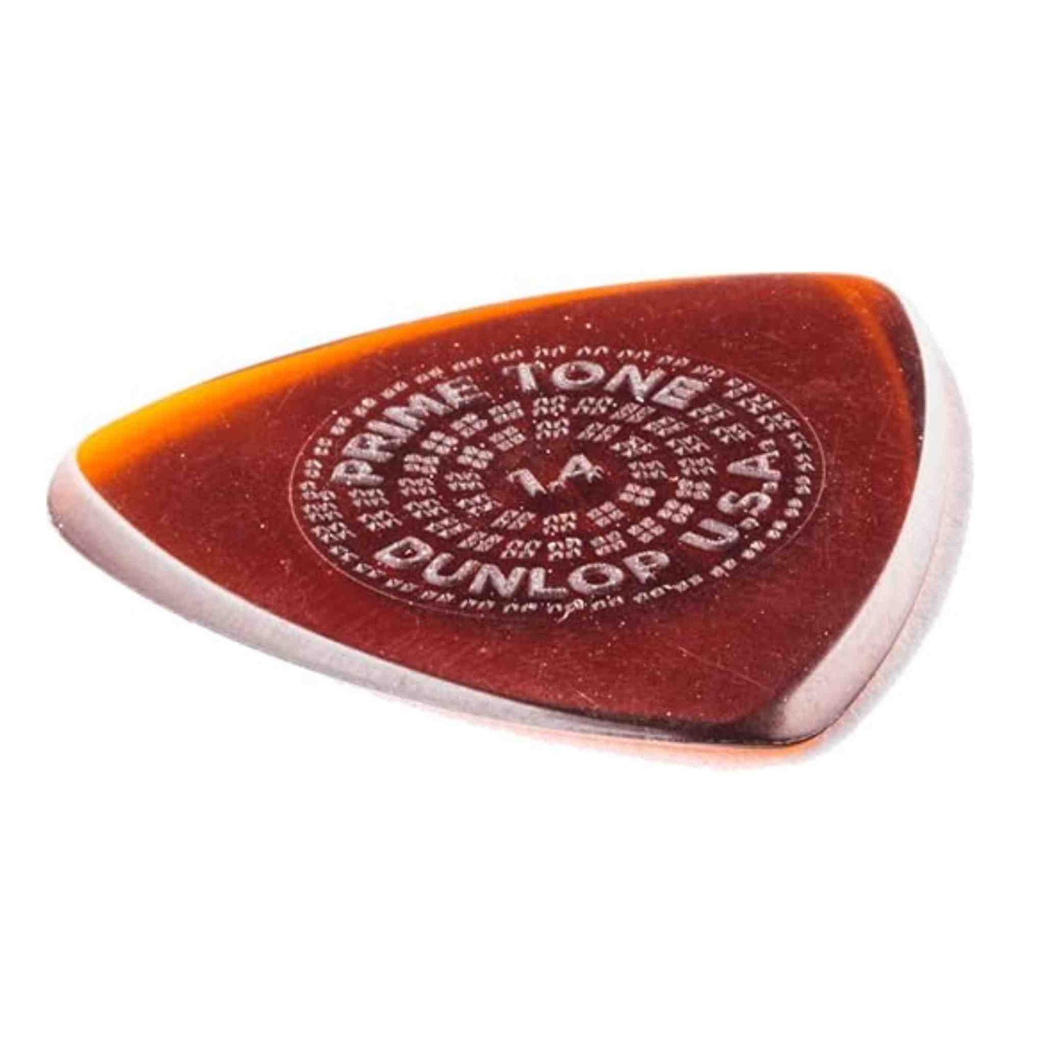The image shows a Dunlop Primetone guitar pick with a teardrop shape, made of translucent amber/tortoiseshell material with an orange-yellow fade. It features "PRIMETONE" printed in a circular pattern and appears smooth with a polished finish and pointed tip. Known for premium quality, grip, and durability, this pick is favored by guitarists for precise playing and tone.