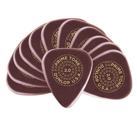 The image shows a fan-like arrangement of Dunlop Primetone guitar picks, each 2.0mm thick. They are dark reddish-brown with gold text in a circular pattern reading "PRIME TONE 2.0 DUNLOP U.S.A." These high-quality, durable picks are favored by serious guitarists for precise control and are suitable for genres like jazz, rock, and metal.