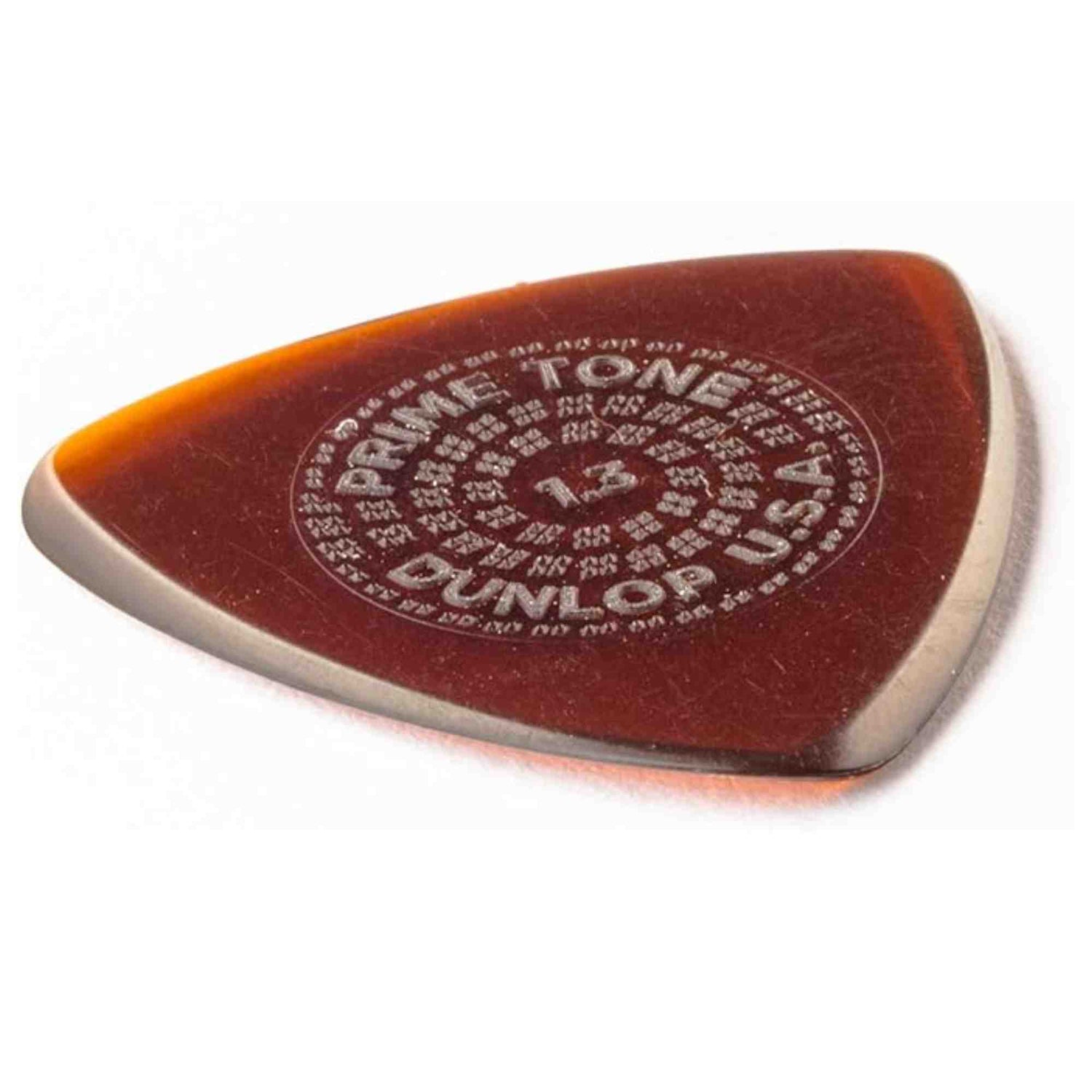 The image shows a triangular Dunlop Primetone guitar pick with a translucent amber/tortoiseshell color featuring darker reddish-brown tones. It has the circular Dunlop Primetone logo and "1.5" thickness text embossed in the center. Made from high-grade material, this 1.5mm thick pick offers excellent grip, control, and a warm tone, popular with both acoustic and electric guitar players.
