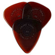 The image shows three Dunlop Primetone guitar picks with a teardrop shape and translucent amber finish. Each pick features embossed circular text reading "PRIME TONE" and "DUNLOP USA," along with a visible thickness of .88mm. Known for their premium construction and sculpted tips, these picks offer durability, good grip, and smooth string release, favored by guitarists for both acoustic and electric playing.