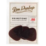 The image shows a package of three Jim Dunlop Primetone guitar picks. They are standard .88mm thick, made of sculpted Plectra material with a textured grip and hand-burnished edges. The picks have a dark reddish-brown tortoiseshell color and are made in the USA. Known for premium quality, these picks offer improved tone, control, and reduced pick noise, favored by guitarists for smooth playability.