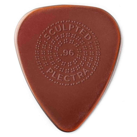 The image shows a reddish-brown guitar pick marked "SCULPTED" at the top, "96" in the center, and "PLECTRA" at the bottom. It features a raised dotted grip pattern radiating around the center, designed to enhance grip and prevent slipping during play. This sculpted texture is typical of premium picks made for better control by serious guitarists.