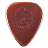 The image shows a translucent amber guitar pick from Sculpted Plectra. It is 1.3mm thick with a classic teardrop shape. The center features a circular pattern of raised dots for enhanced grip, with "SCULPTED PLECTRA" embossed around it. Designed for better control, the pick balances flexibility and rigidity, suitable for both strumming and precise playing.