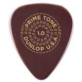 The image shows a teardrop-shaped, tortoiseshell-colored guitar pick with gold text and a dotted circular design. It reads "PRIME TONE" at the top, "DUNLOP U.S.A." at the bottom, and "1.0" in the center, indicating a 1.0mm thickness. This Dunlop Primetone pick is a medium-heavy gauge popular for its smooth surface and versatile use in strumming and lead playing.