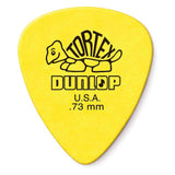 The image shows a yellow Dunlop Tortex guitar pick with a teardrop shape. It features the curved "TORTEX" text on the turtle shell design, bold "DUNLOP" lettering, "U.S.A." marking, and ".73 mm" thickness. This medium-gauge pick is known for its durability, bright yellow color, good grip, consistent tone, and balanced flexibility popular among guitarists.