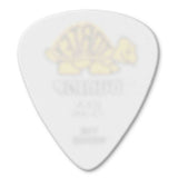 The image shows a white or off-white teardrop-shaped guitar pick (plectrum) with faint, unreadable text or a logo in the center. Guitar picks are common accessories used to pluck or strum strings and come in various thicknesses, materials, and designs to match different playing styles and tones.