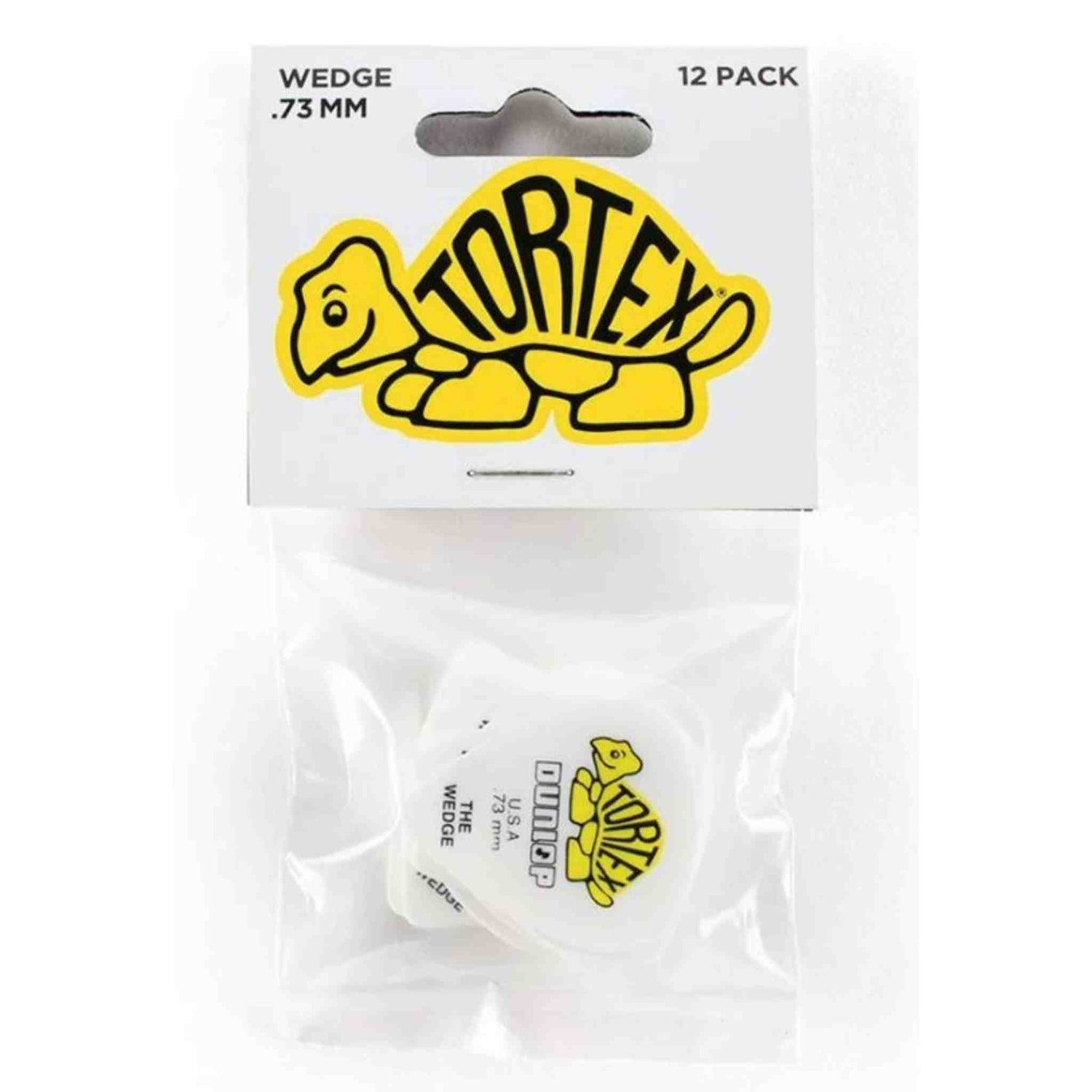 The image shows a 12-pack of Tortex wedge-shaped guitar picks, 0.73mm thick, in clear plastic packaging with a white card header featuring the yellow and black Tortex turtle logo. One white/clear pick with the logo is visible inside. Made by Dunlop, these medium-gauge picks are known for durability and a textured grip, suitable for various playing styles from strumming to lead guitar.