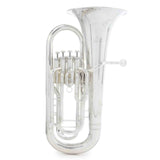 The image shows a silver-plated concert tuba with a large flared bell, four piston valves, and extensive tubing in the typical upright configuration. It includes a mouthpiece receiver and is likely a BB♭ or CC model, common for orchestras and bands. The bright reflective finish indicates it is a professional or semi-professional quality brass instrument, known for its low pitch and bass role in ensembles.