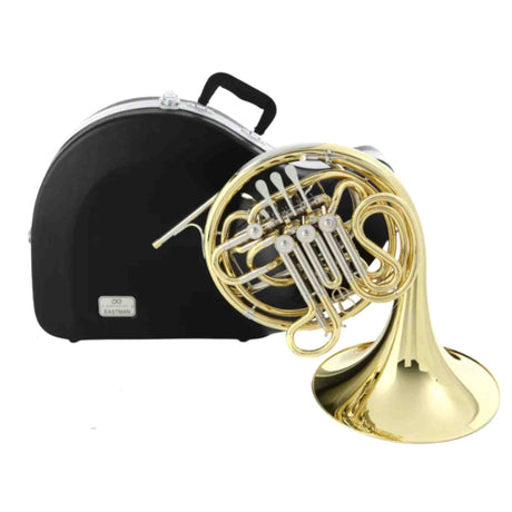 The image shows a French horn with coiled brass and silver tubing, rotary valves, and a wide flared bell. It is placed next to a hard shell carrying case with a black interior lining and a handle. The case interior features an "EASTMAN" label, indicating the brand of the instrument. This setup is typical for protecting and transporting French horns.
