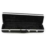 The image shows a black hard case with white or silver trim and multiple metal latches, open to reveal a plush, velvet-lined interior designed to protect a string instrument. The rectangular case, likely for a violin, viola, or small guitar, features molded compartments to securely hold the instrument. This sturdy case provides protection against impact, moisture, and temperature during storage and transport.