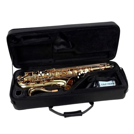 Gold Tenor saxophone in a black case on a white background
