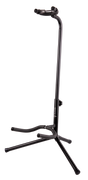 The image shows a black TETON guitar stand with a tripod base and adjustable vertical pole. It has padded curved yokes to cradle the guitar’s body and a lower support arm for the guitar’s bottom. Designed for acoustic or electric guitars, the stand offers stable, secure storage and protection from scratches, making it ideal for home, studio, or stage use.
