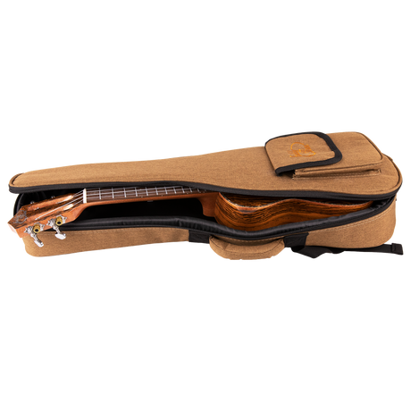 A ukulele inside of a tan gig bag with Eddy Finn branding