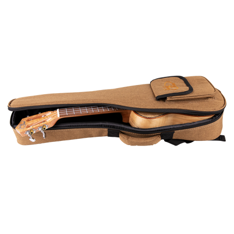 A ukulele inside a tan colored gig bag with Eddy Finn branding on a white background