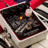 An angled view of the Electro-Harmonix Key9 synth pedal resting on the keys of a keyboard.