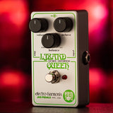 Side view of the Electro-Harmonix Lizard Queen Nano guitar pedal. Green lettering and artwork is visible along with the black control knobs and silver on/off swictch.