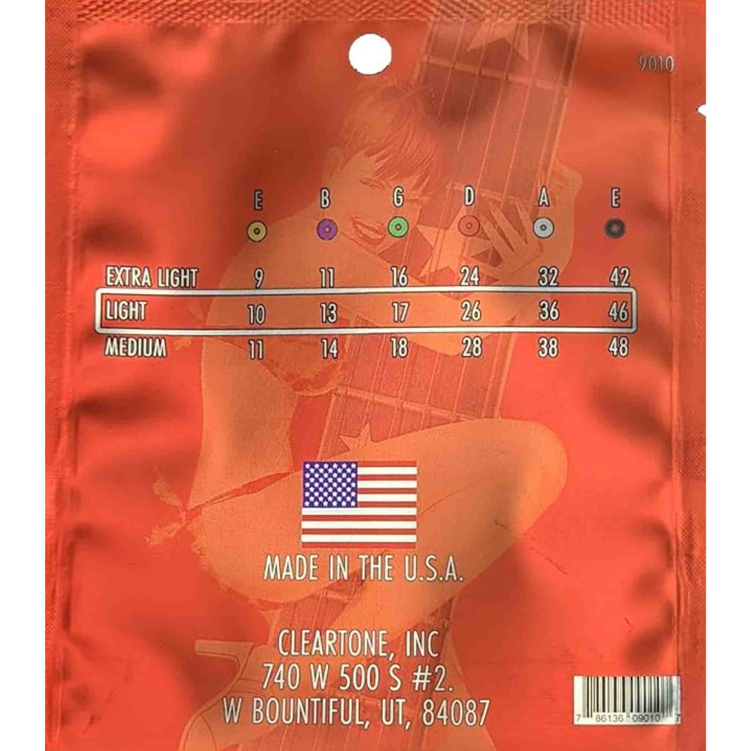 The image shows a Cleartone, Inc. guitar string package featuring a gauge chart for Extra Light (9-42), Light (10-46, highlighted), and Medium (11-48) sets. Strings are labeled with standard tuning notes (E, B, G, D, A, E) and color-coded dots. The orange/red package has a guitar silhouette, includes company info, a USA flag, a barcode, and a hanging hole for retail display.